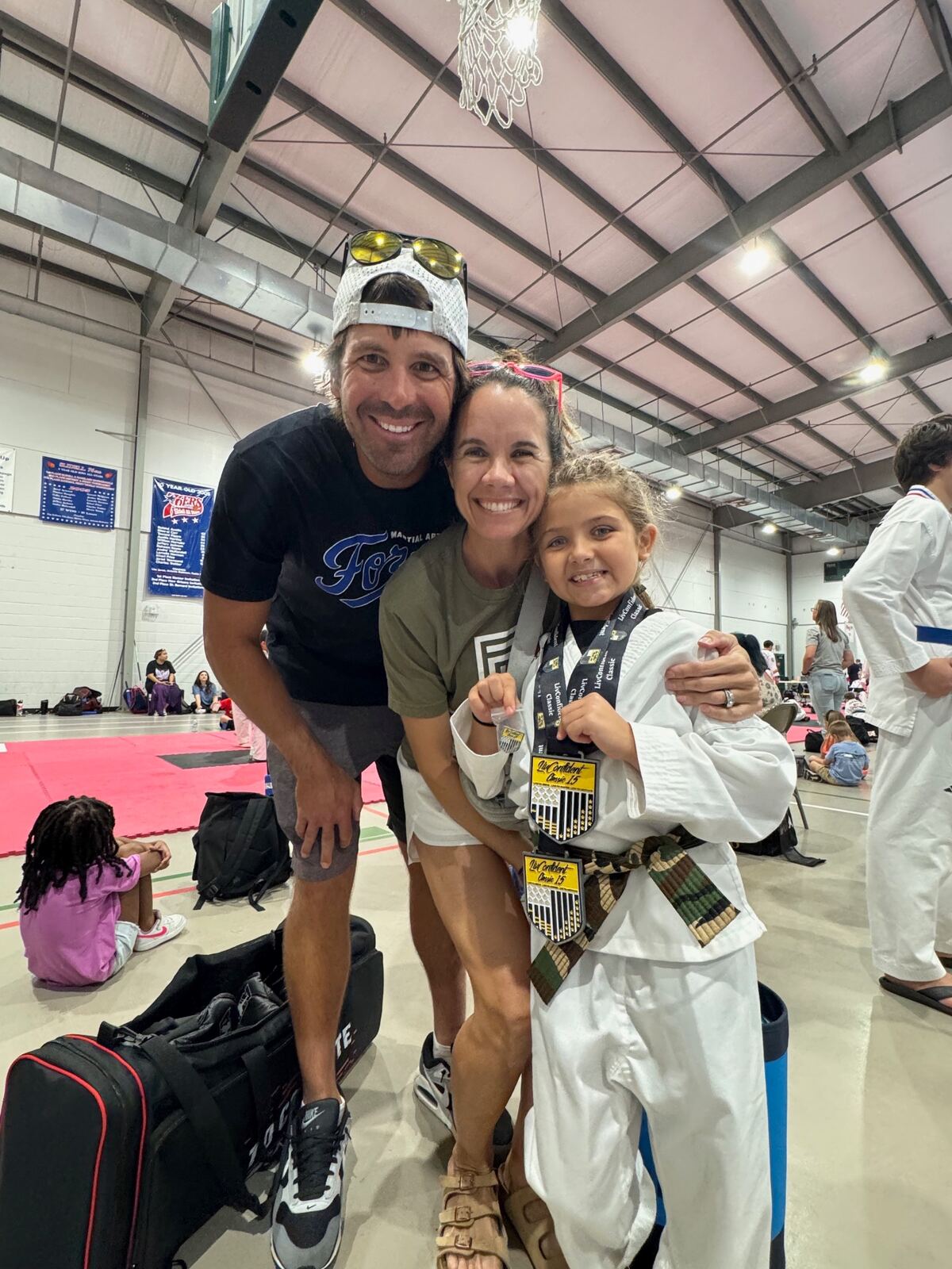 Forge family celebrating tournament wins