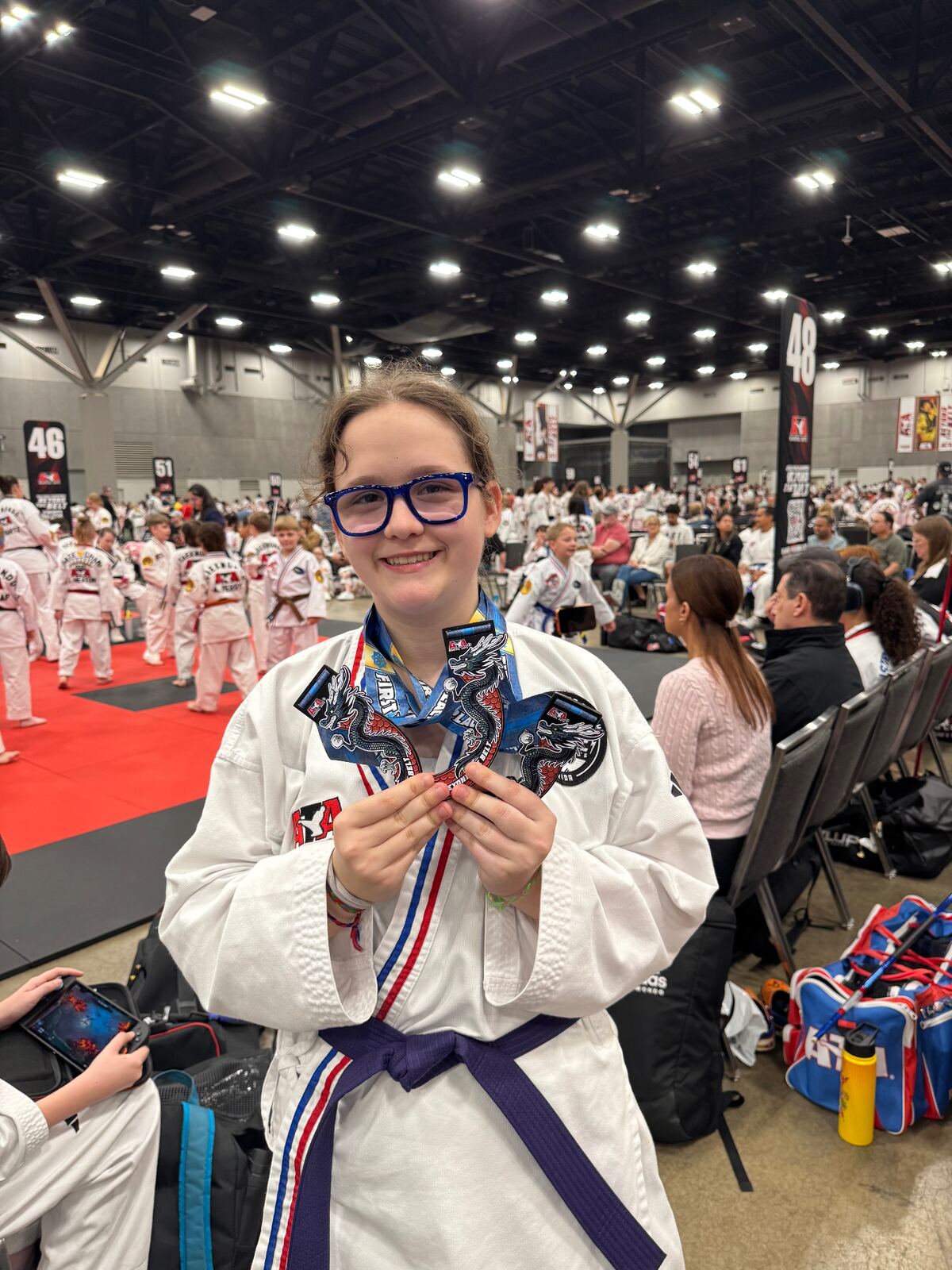 Young Forge student with ATA medals