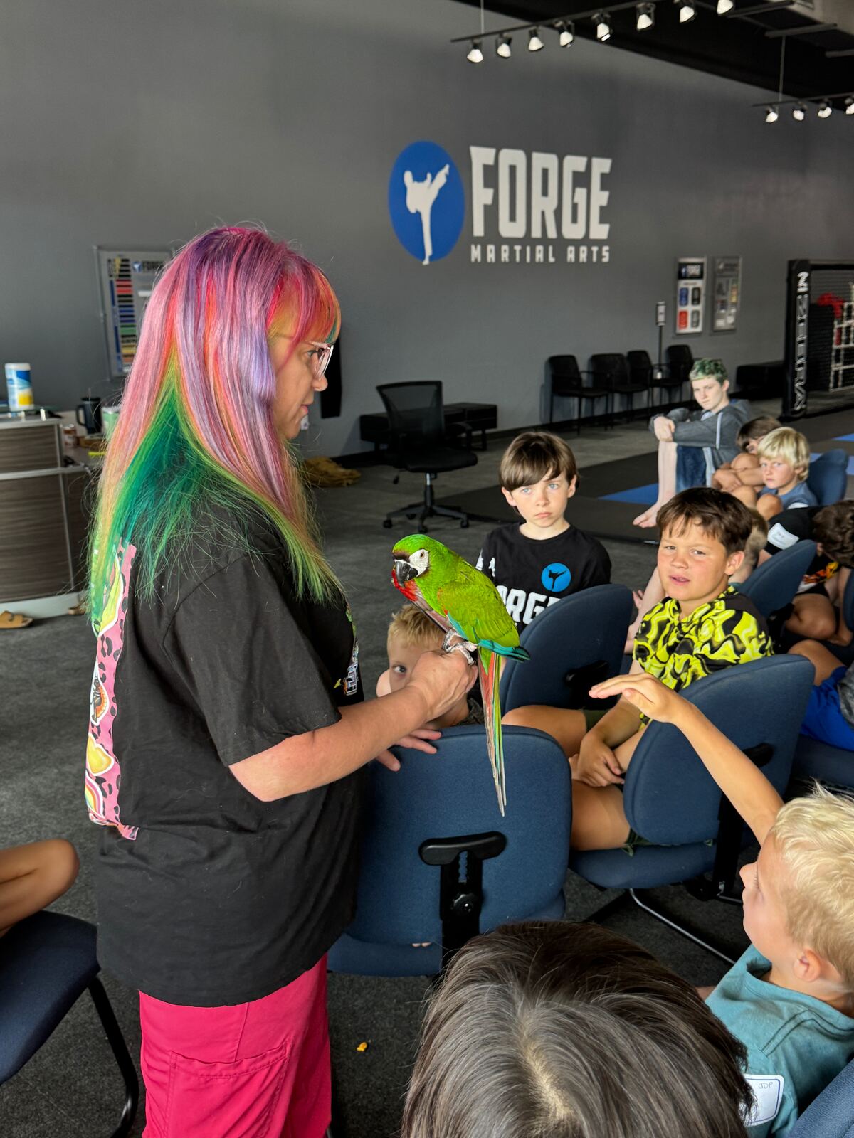 Special guest with parrot visiting camp