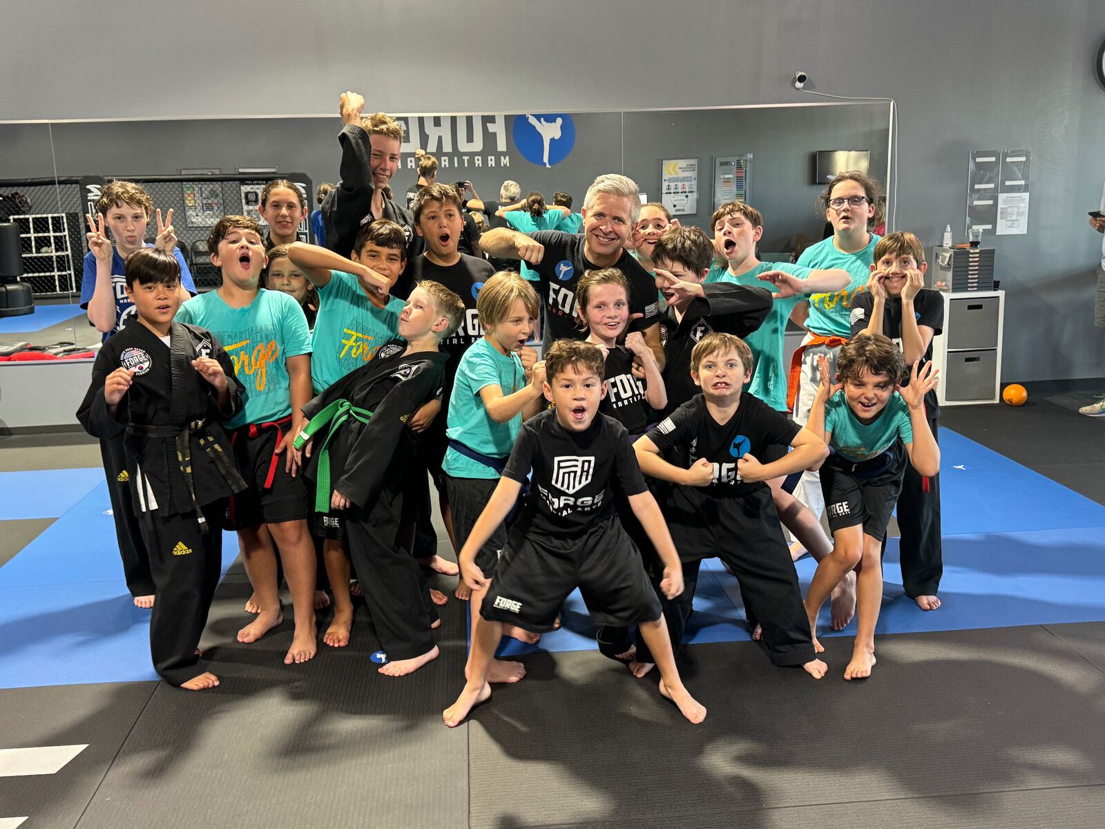 Camp group with instructor making fun faces