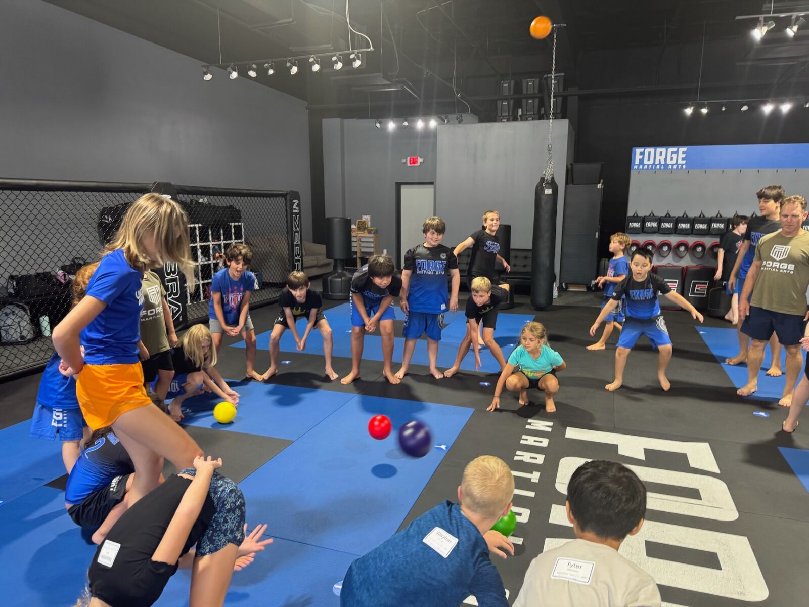 Campers playing dodgeball on Forge mats
